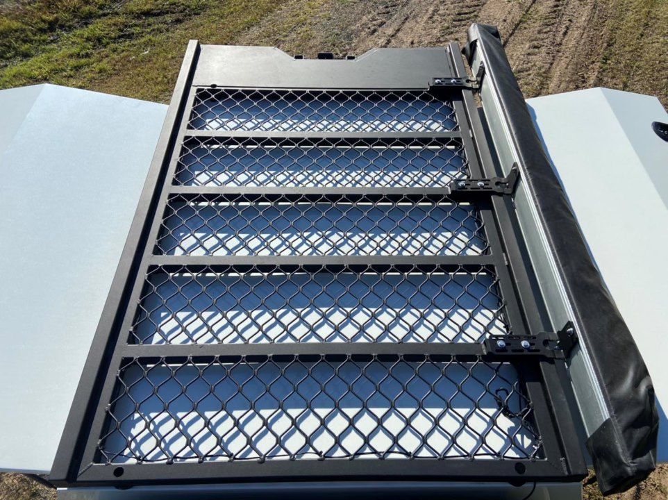 A White Van With a Roof Rack Attached to the Roof — Custom RV Creations & Repairs in Sumner, QLD