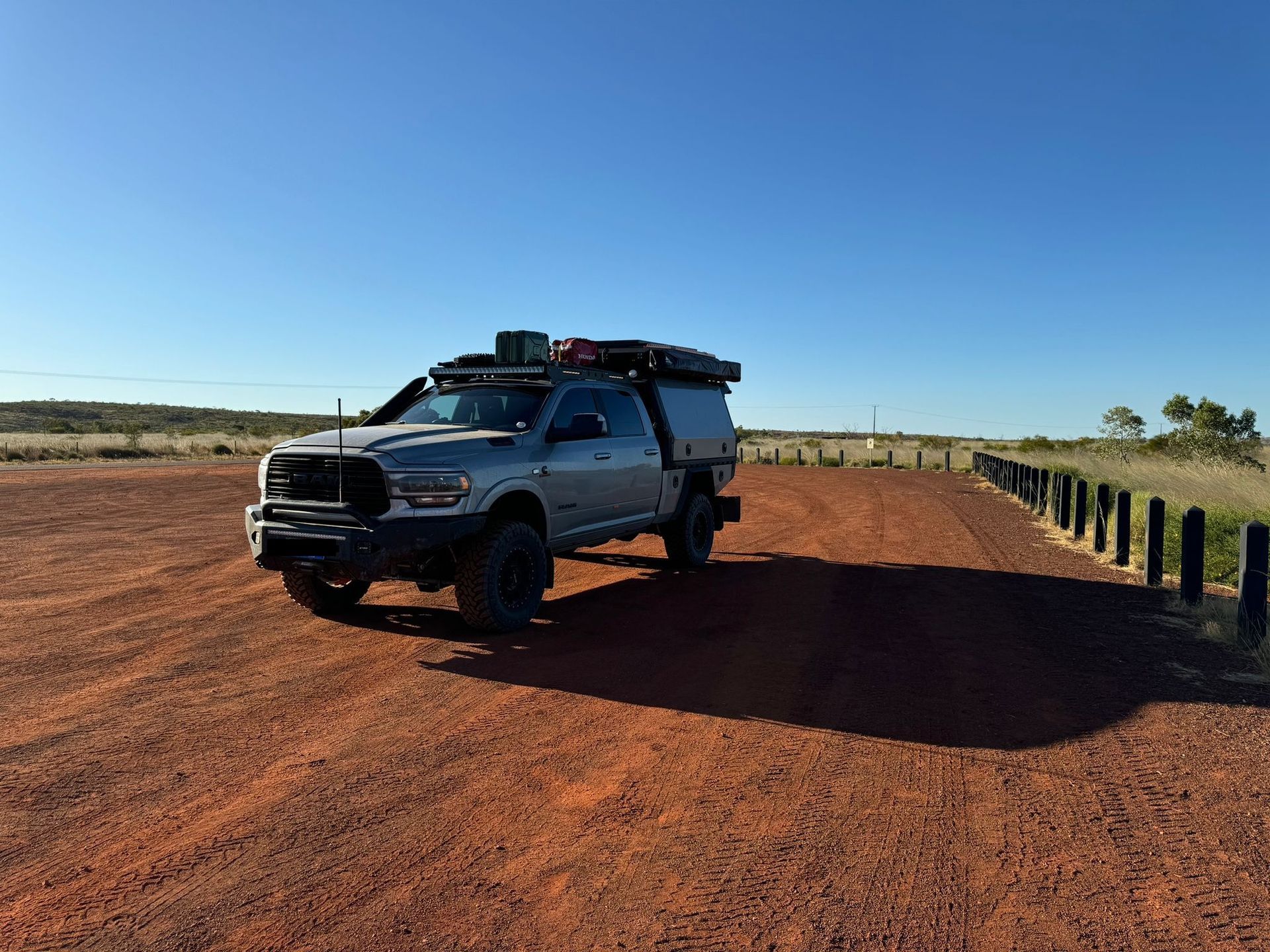 Silver Truck on a Red Dirt Road With a Blue Sky — Custom RV Creations in Sumner, QLD