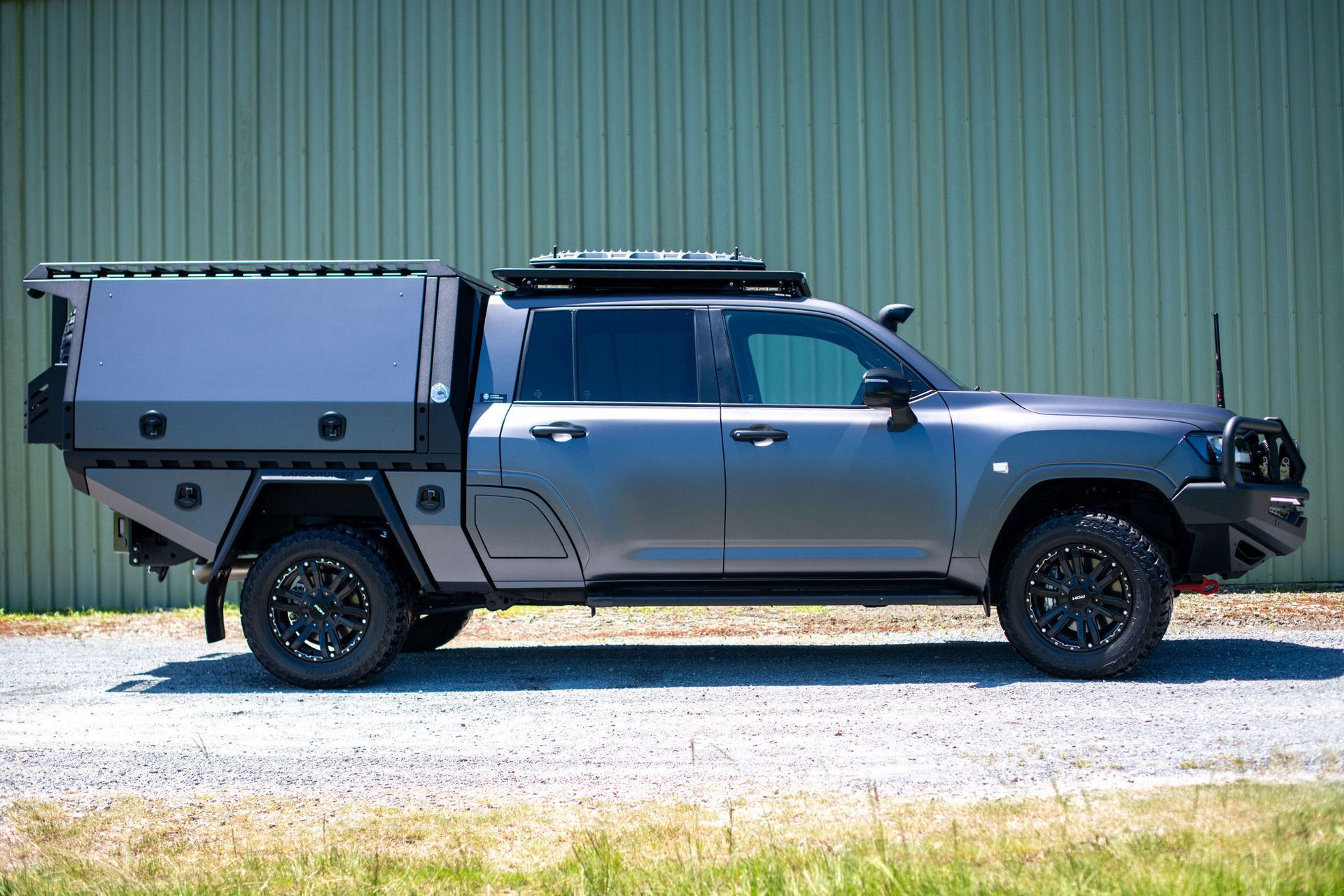 Modified Truck With Utility Bed, Roof Rack, and Off-road Tires — Custom RV Creations in Sumner, QLD