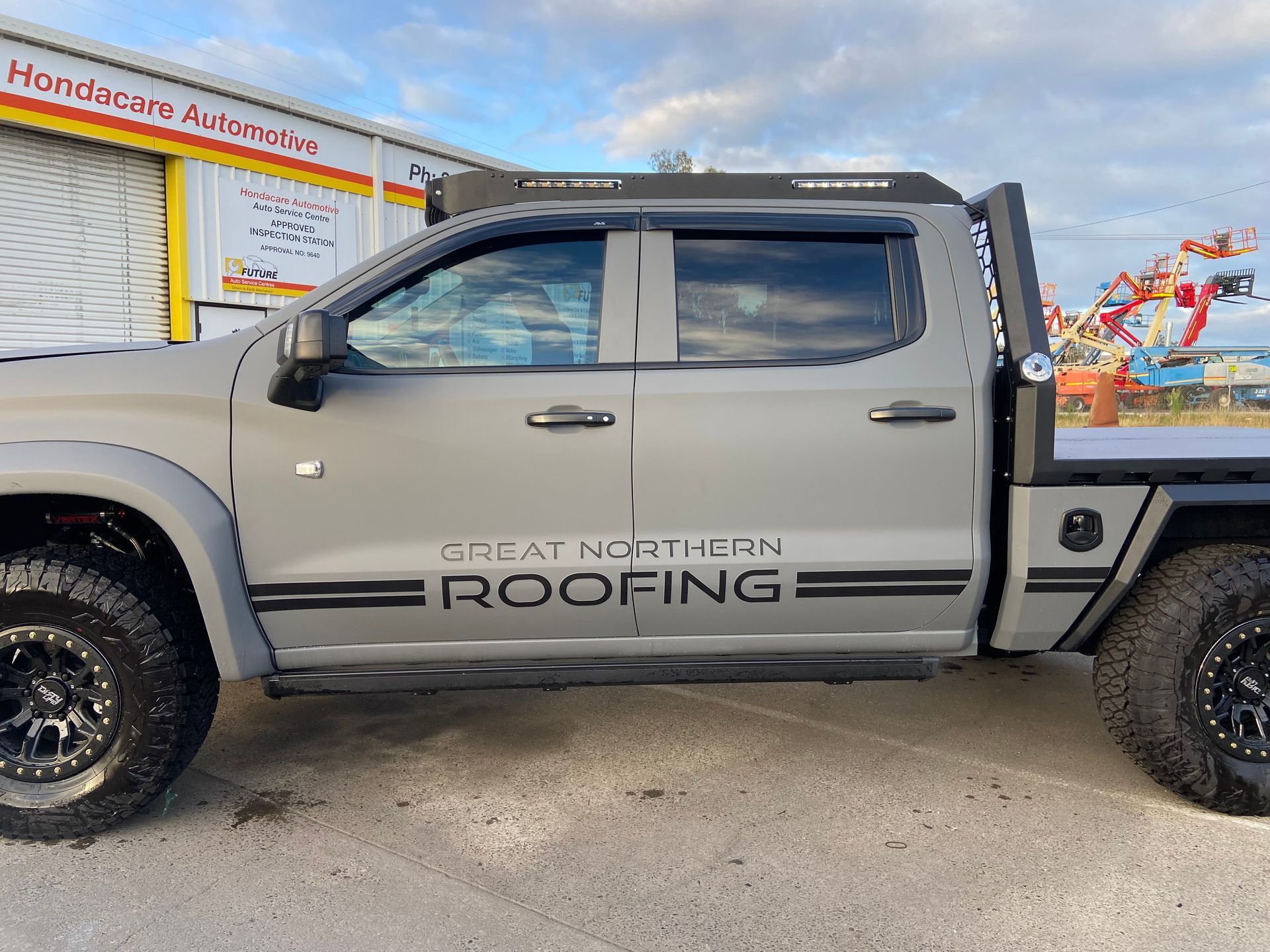 Grey Pickup Truck With Great Northern Roofing Logo on the Side — Custom RV Creations in Sumner, QLD