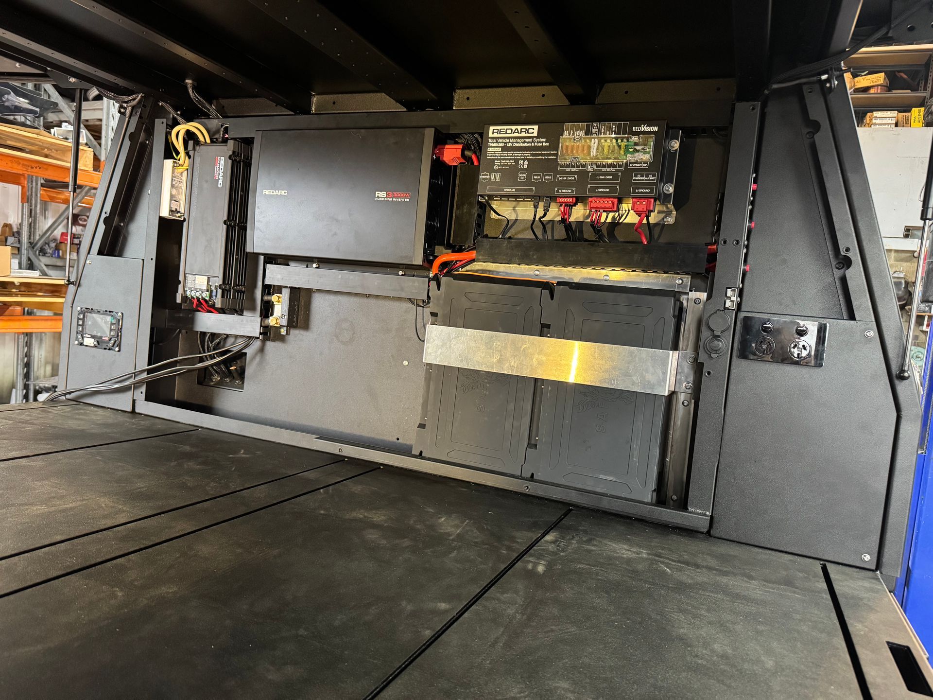 Dark Grey Truck Bed Setup With Electrical Components, Batteries, and Control Panel — Custom RV Creations in Sumner, QLD