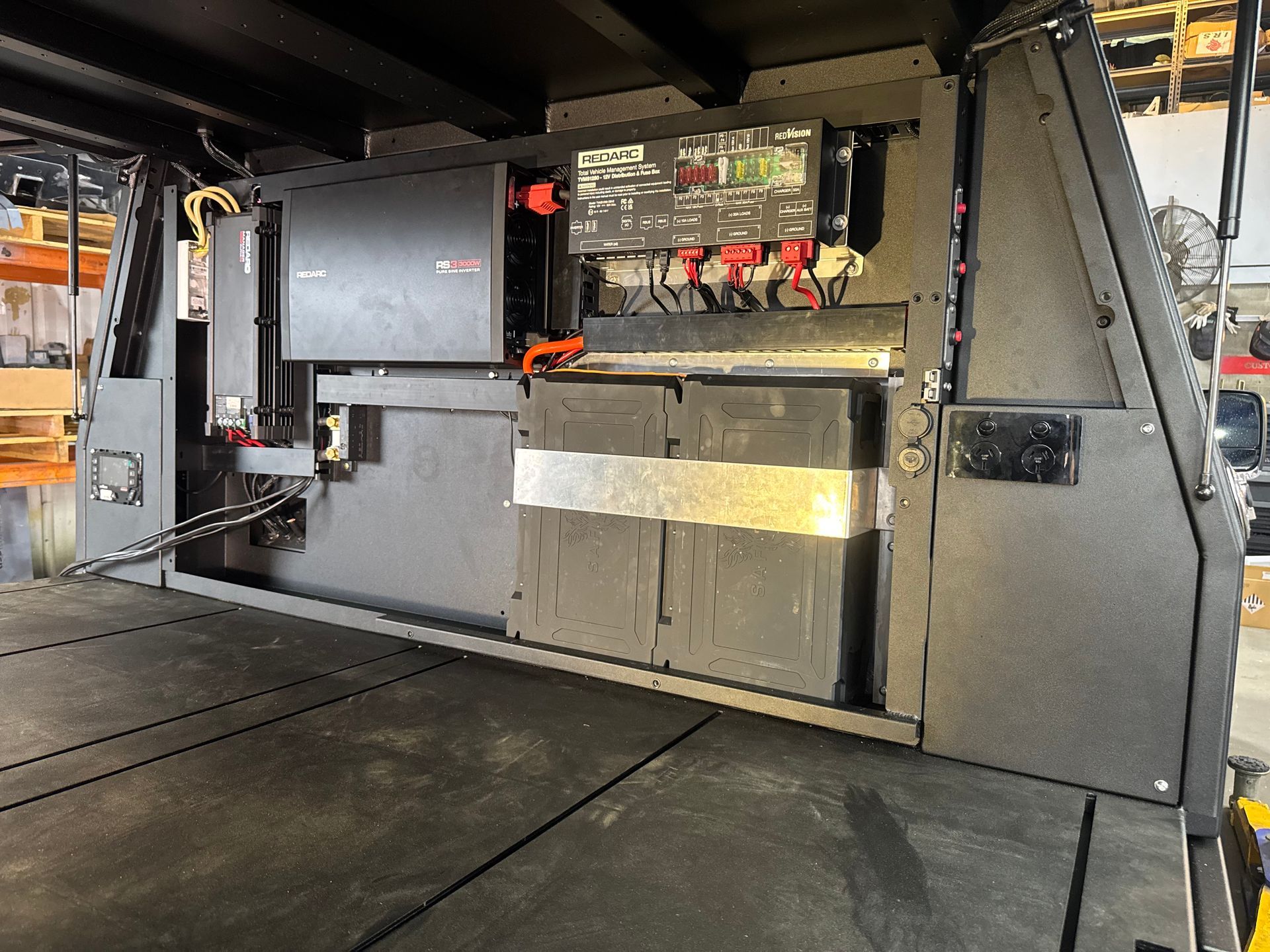 Black Metal Truck Bed With Integrated Electrical Components and Wiring — Custom RV Creations in Sumner, QLD