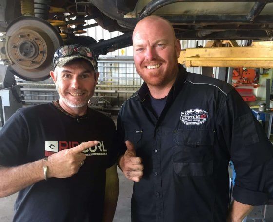 Two Men Are Posing for a Picture — Custom RV Creations & Repairs in Sumner, QLD