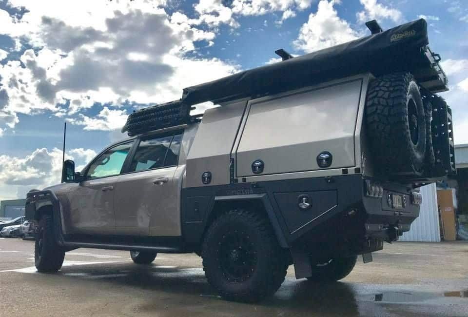 A Vehicle With a Canopy on It is Parked in a Parking Lot — Custom RV Creations & Repairs in Sumner, QLD