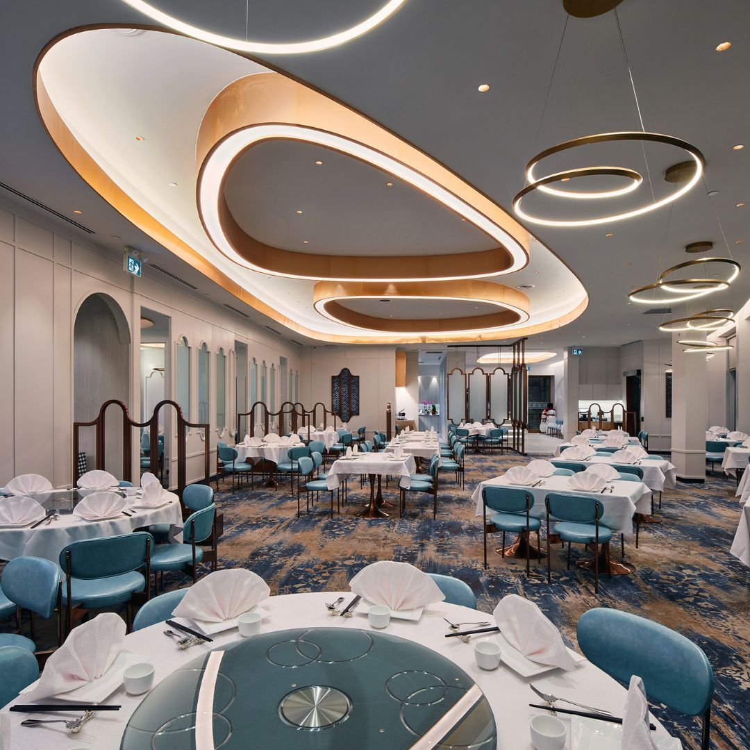 A large room with tables and chairs in it