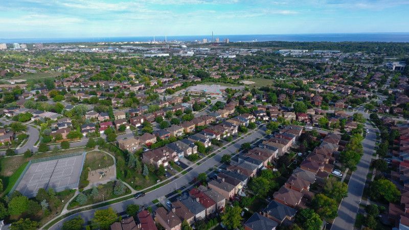 An aerial view of a residential area with lots of houses and trees.