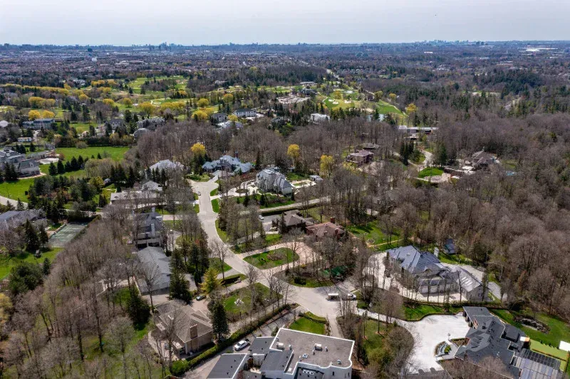 An aerial view of a residential area with lots of houses and trees.