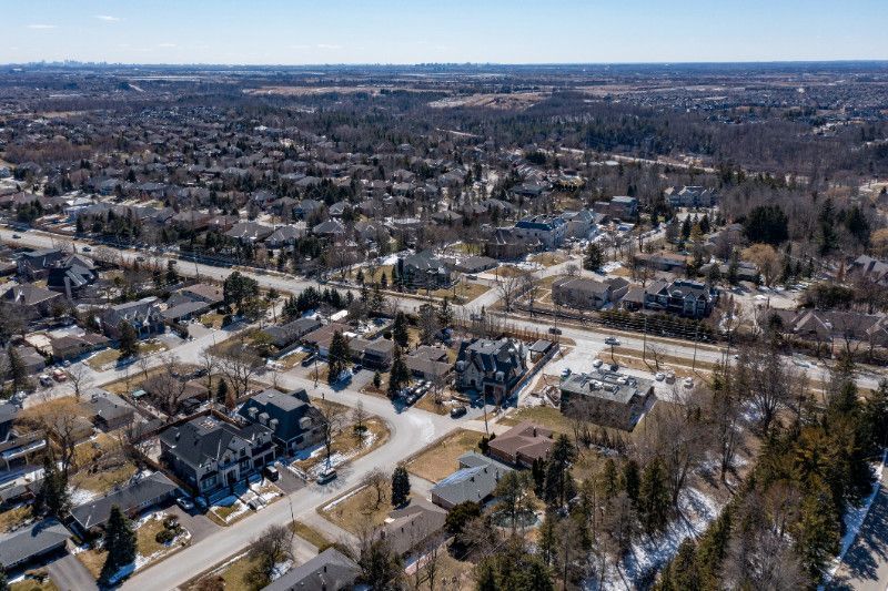 An aerial view of a residential area with lots of houses and trees.