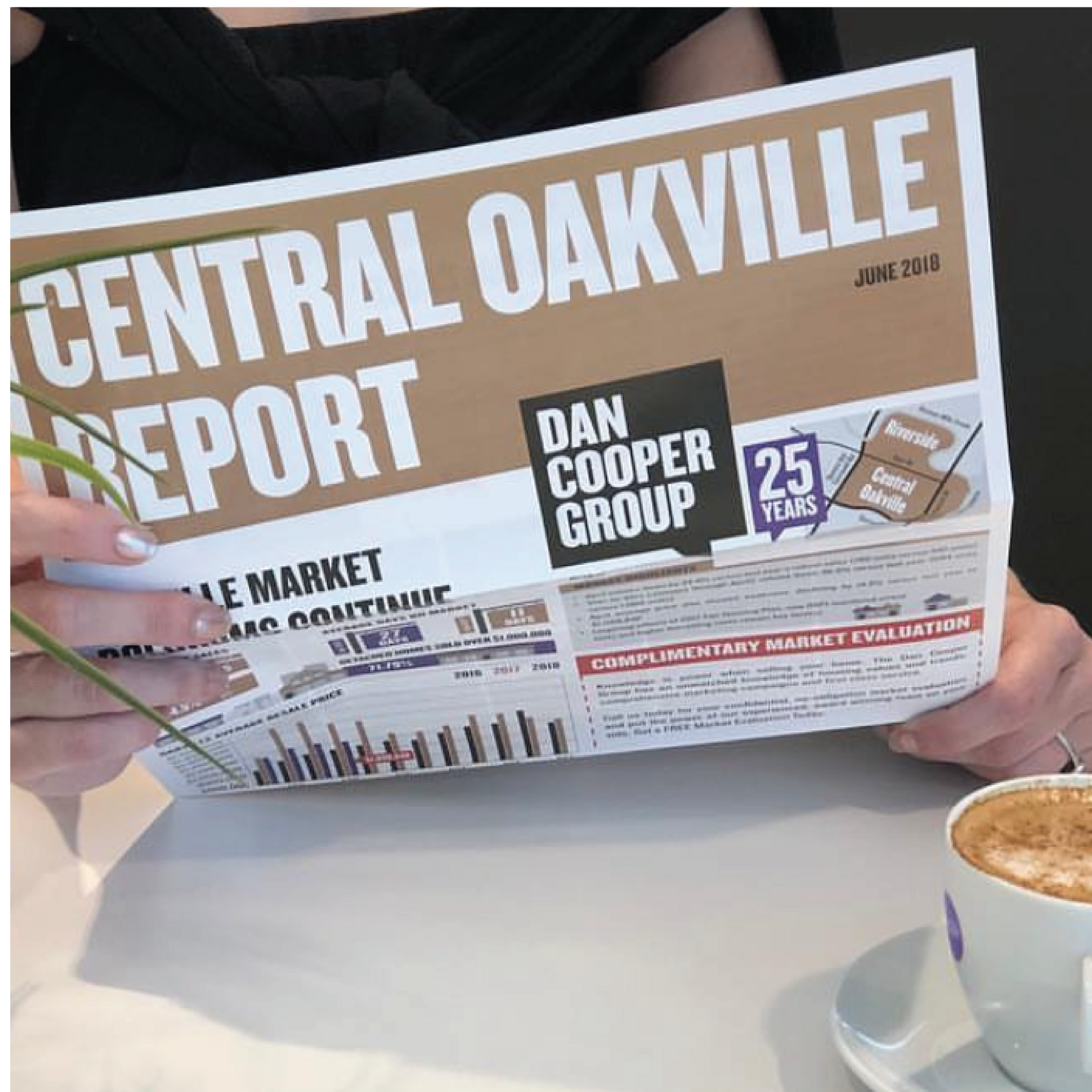 A person is reading the central Oakville report