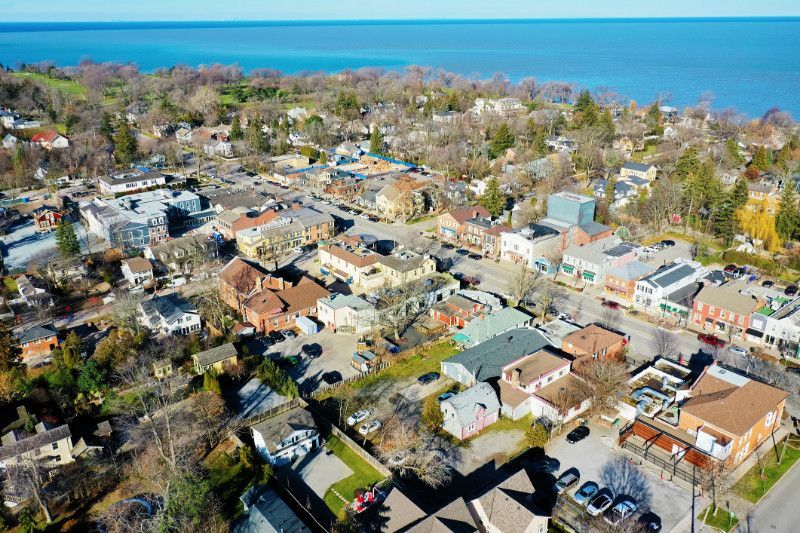 An aerial view of a small town next to a body of water.