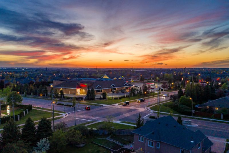 An aerial view of a residential area at sunset.