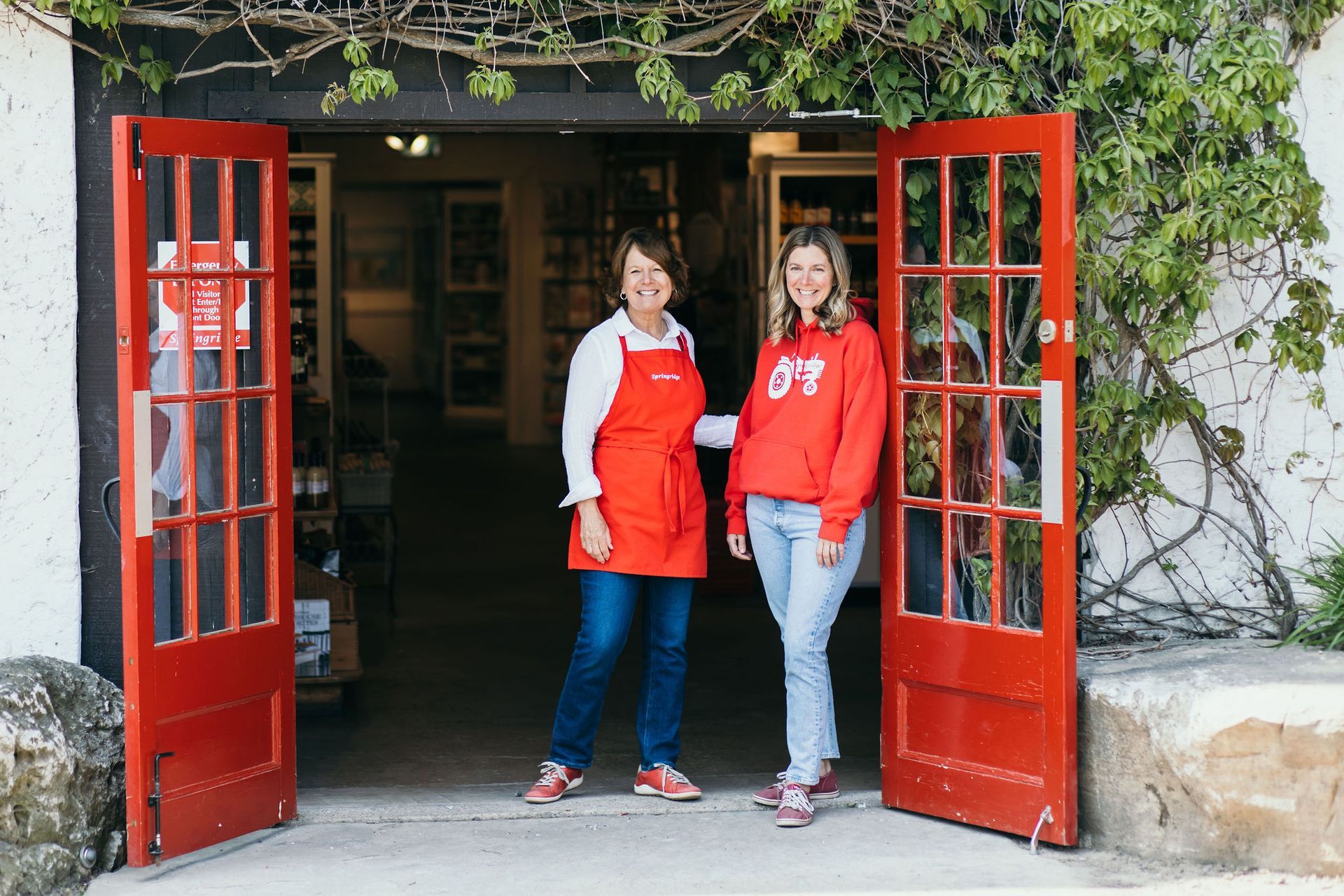 A dining room with a round table and blue chairs
