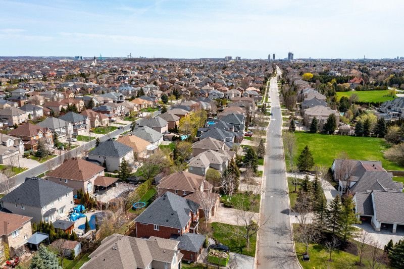 An aerial view of a residential area with lots of houses and trees.