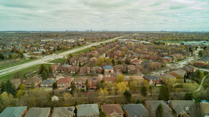 An aerial view of a residential area with lots of houses and trees.