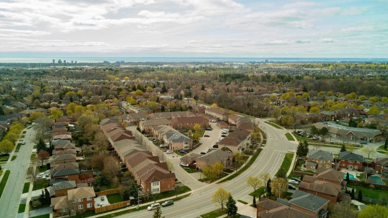 An aerial view of a residential area with lots of houses and trees.