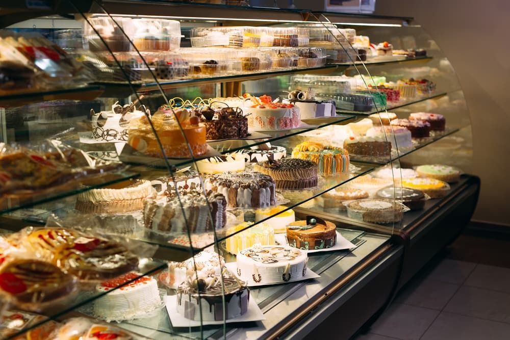 A Display Cakes in A Bakery — Gordon's Air Conditioning & Refrigeration Services in Sunshine Coast, QLD