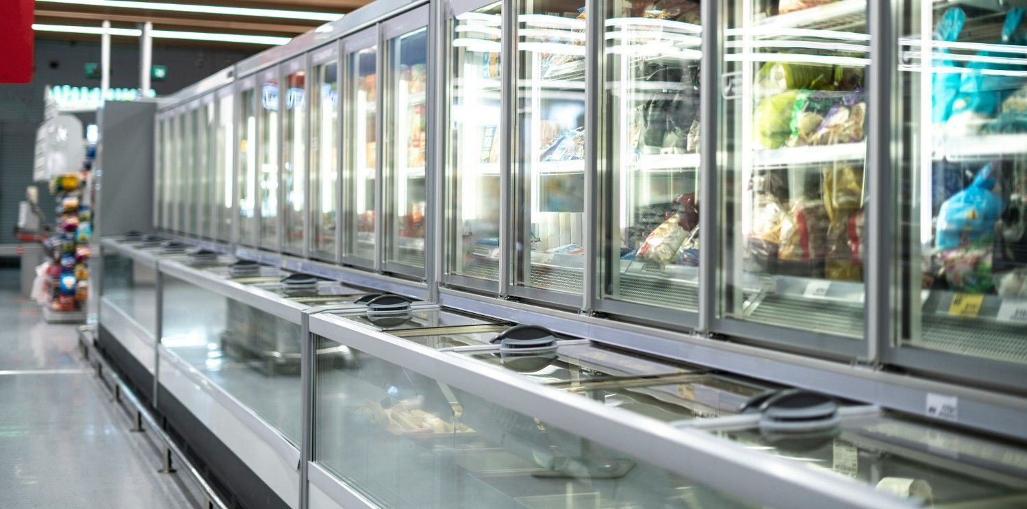 A Row of Refrigerated Display Cases in A Grocery Store — Gordon's Air Conditioning & Refrigeration Services in Kilcoy, QLD