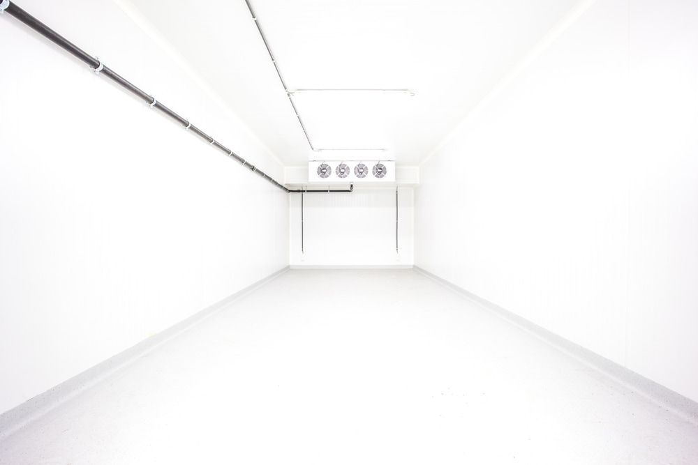 An Empty White Cool Room — Gordon's Air Conditioning & Refrigeration Services in Caloundra, QLD