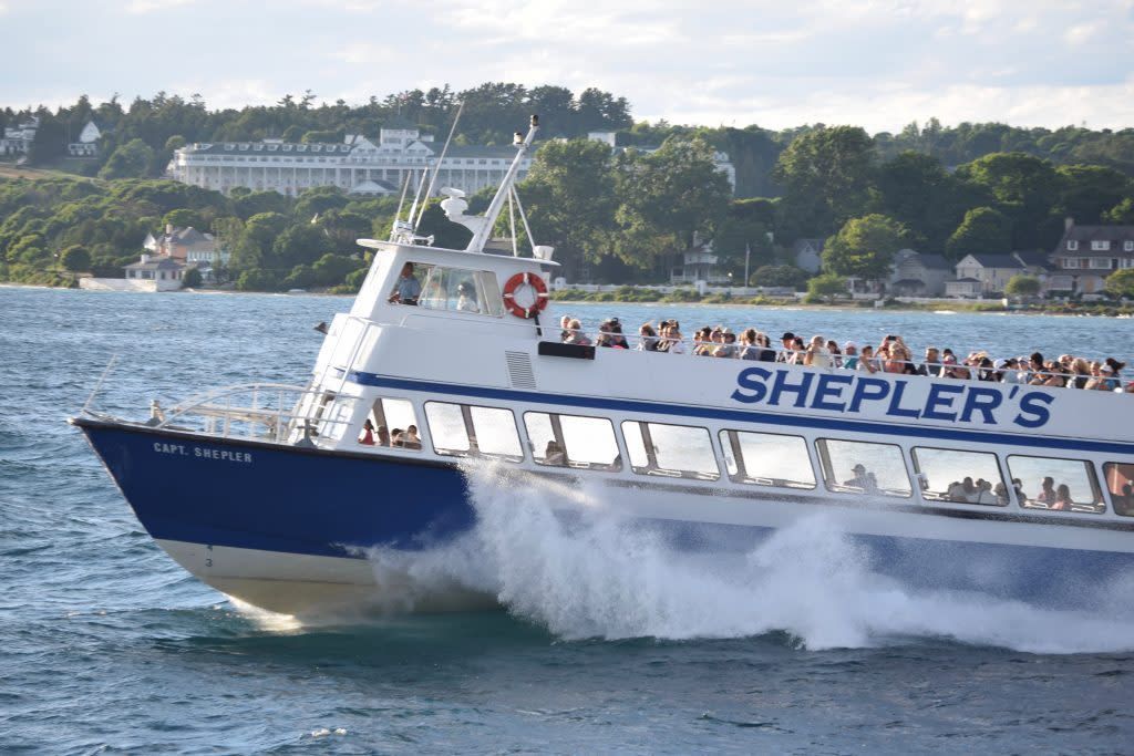 A shepler 's boat is floating on the water
