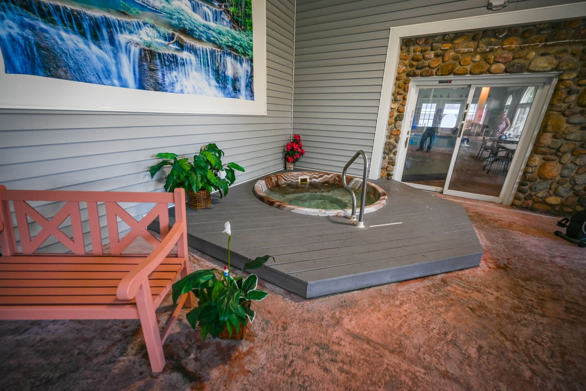 There is a hot tub in the middle of the room.