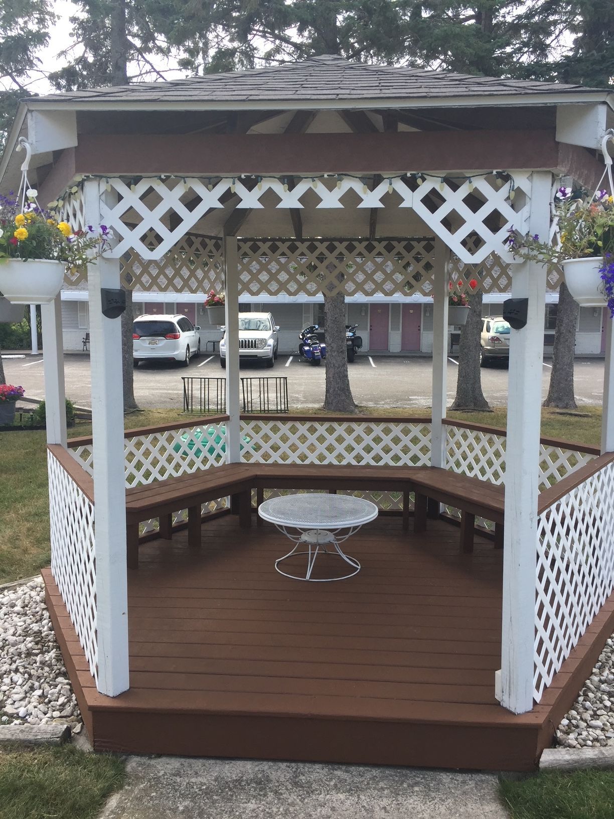 A gazebo with a table in the middle of it
