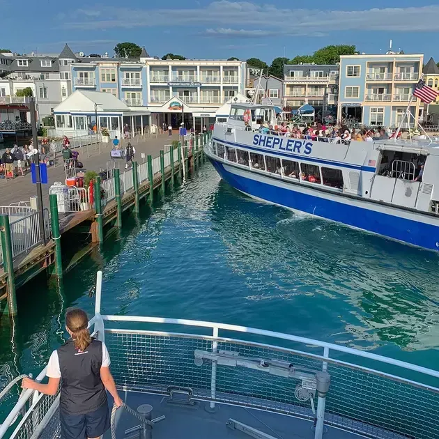 A boat called shepler 's is docked at a dock.