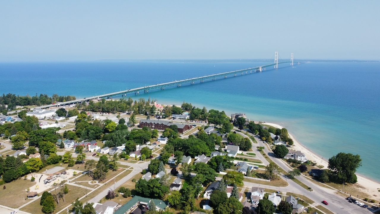 An aerial view of a bridge over a body of water.
