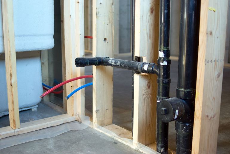 A concrete floor is being repaired in a garage.