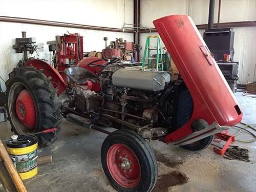 Red Tractor on Repair — Servicing Equipment in Fort Worth, TX