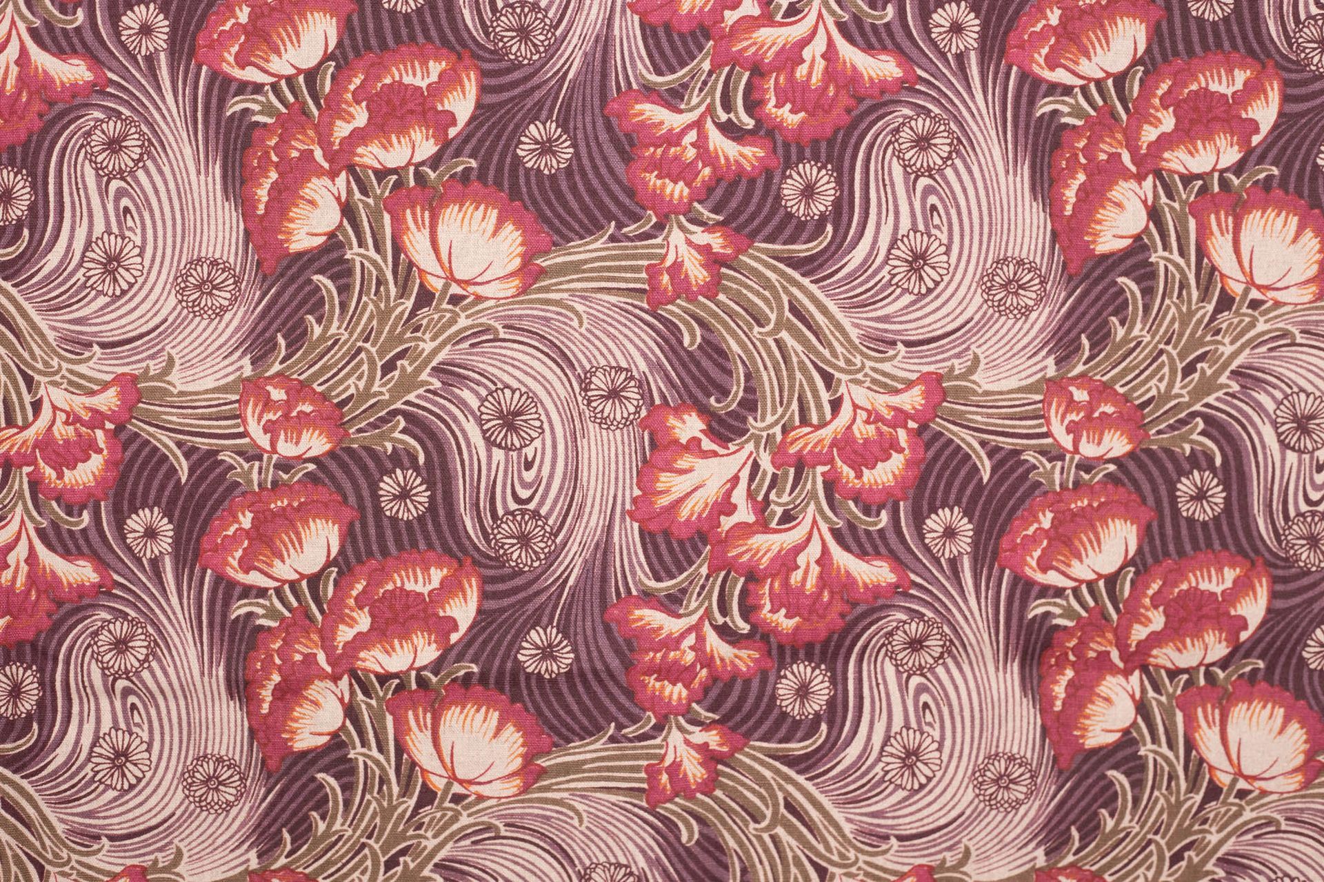 A close up of a curtain with a floral pattern on it.