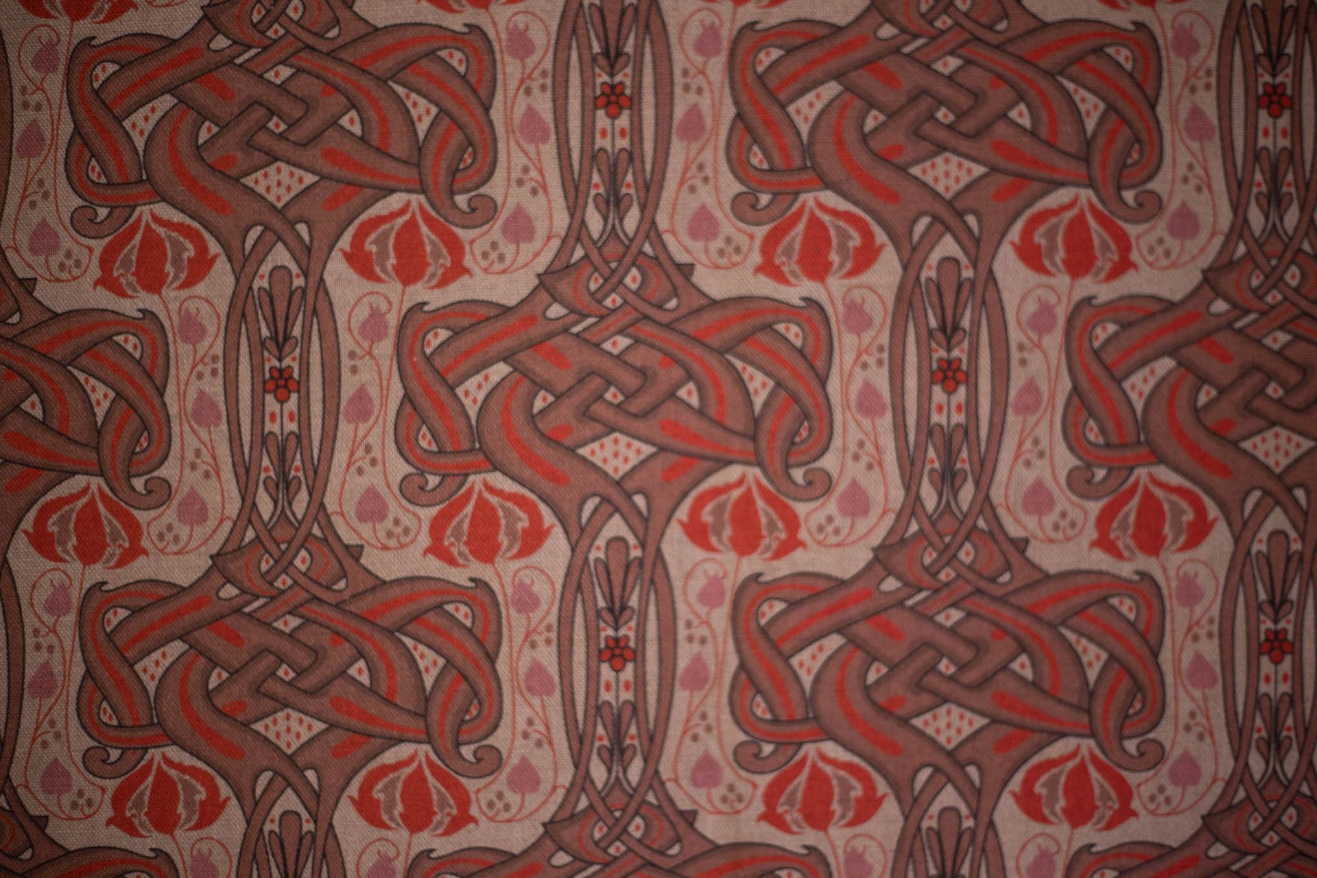 A close up of a fabric with a celtic pattern on it