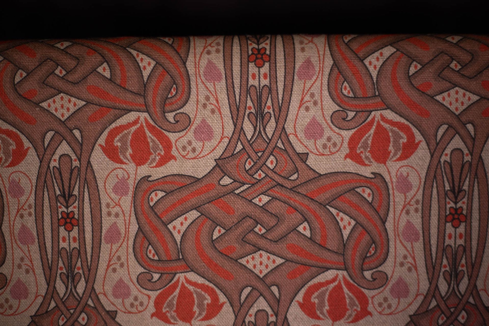 A close up of a fabric with a celtic design on it.