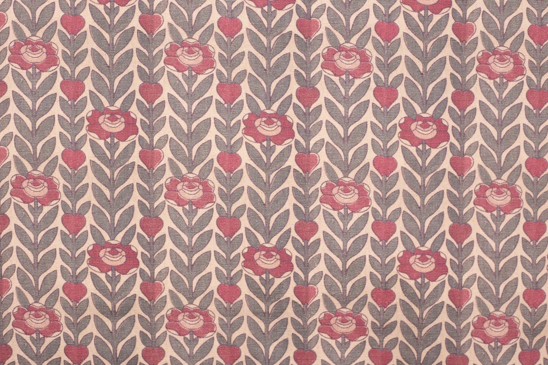 A close up of a curtain with a floral pattern on it.