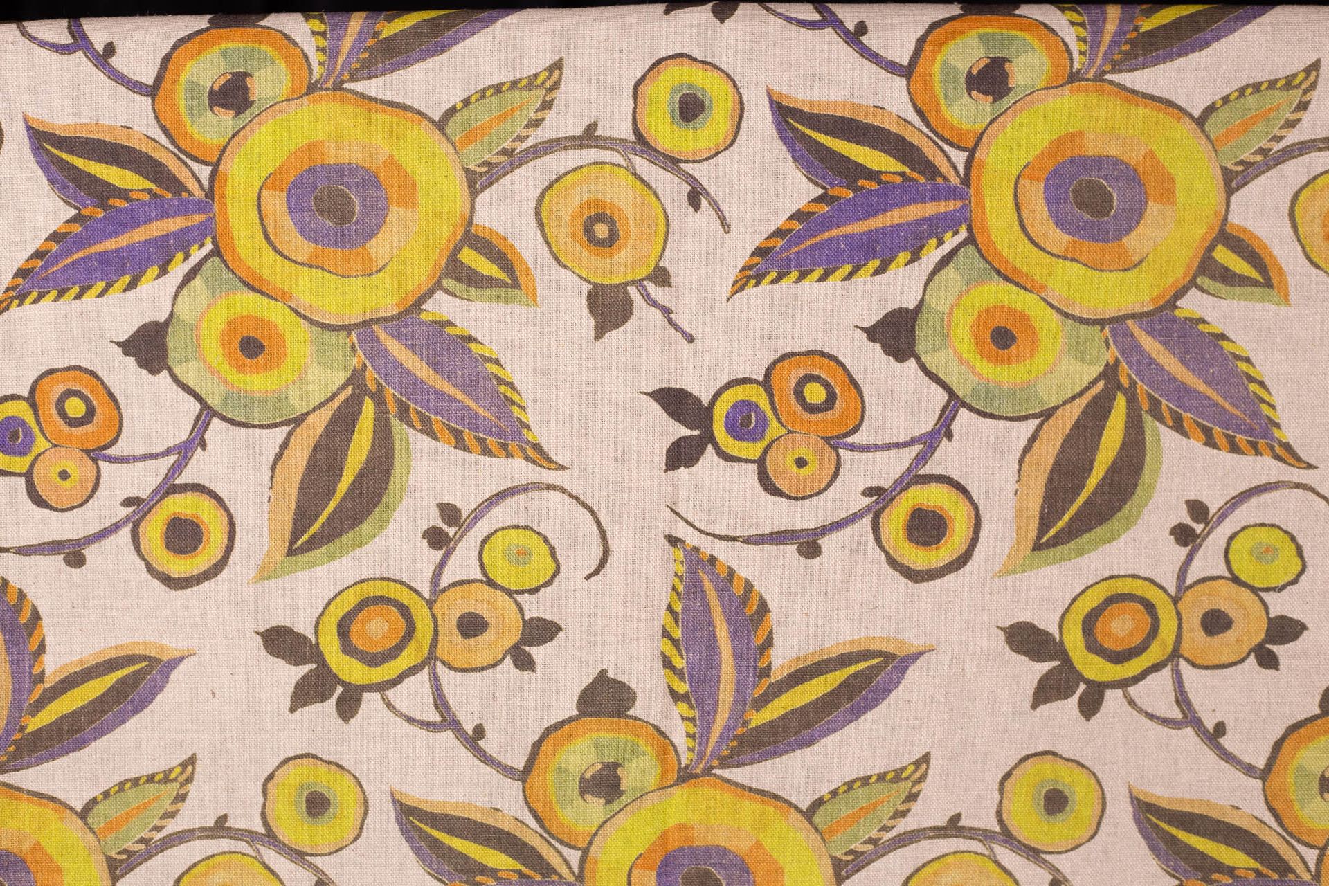 A close up of a curtain with a floral pattern on it