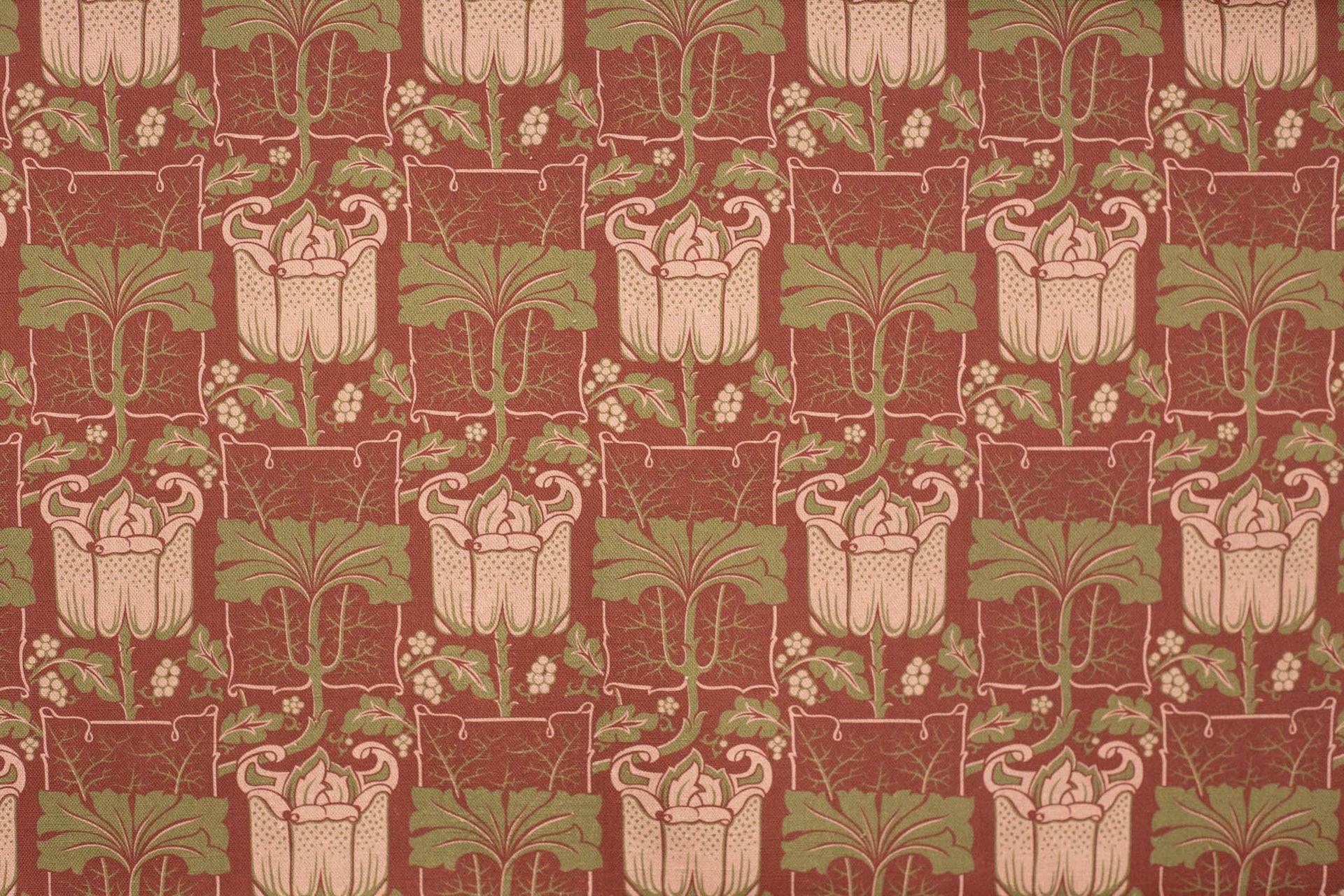 A close up of a curtain with a floral pattern on it.