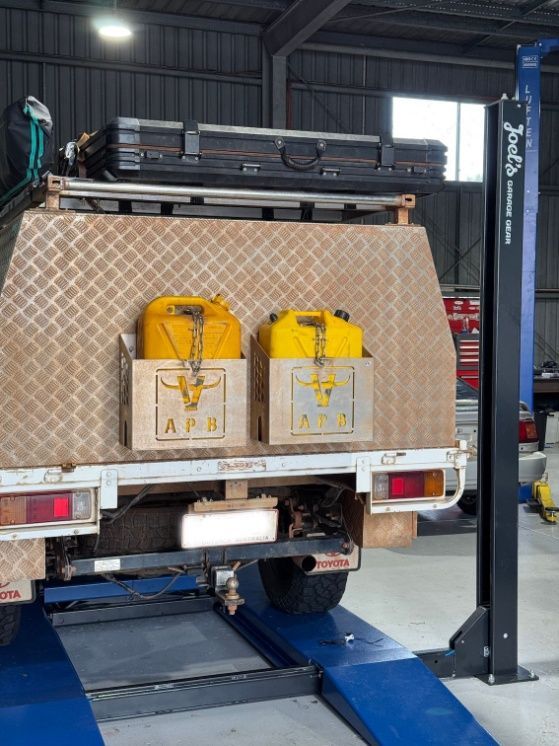 Rear View Of 4WD On Hoist— Axton Automotive Services in Kunda Park, QLD