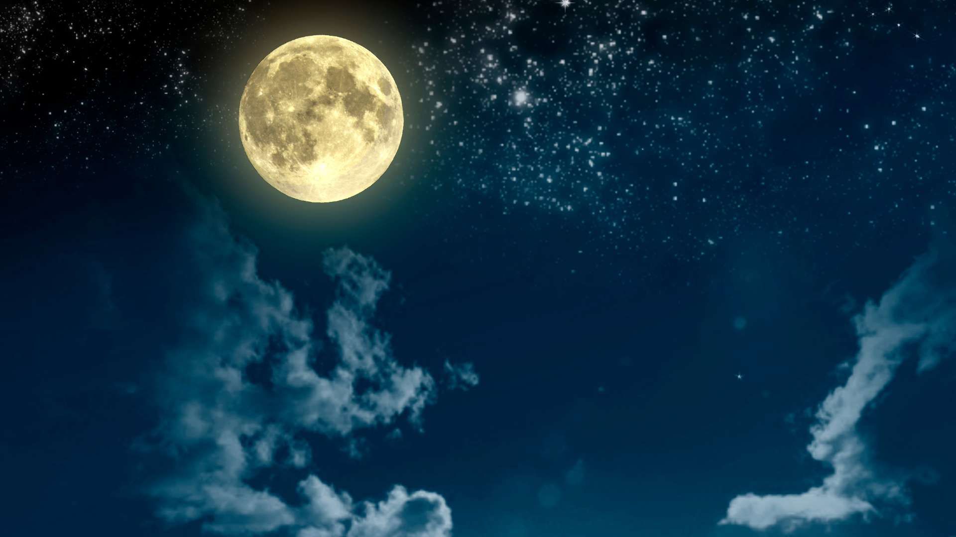 Bright full moon over a dark blue starry sky with wispy clouds