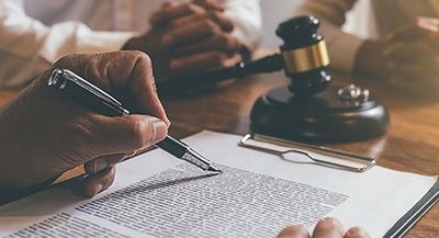 Signing a Document — Bay Area, CA — Law Offices of Mark R. Mittelman, P.C.