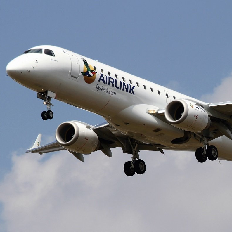 a white airlink plane is flying in the sky