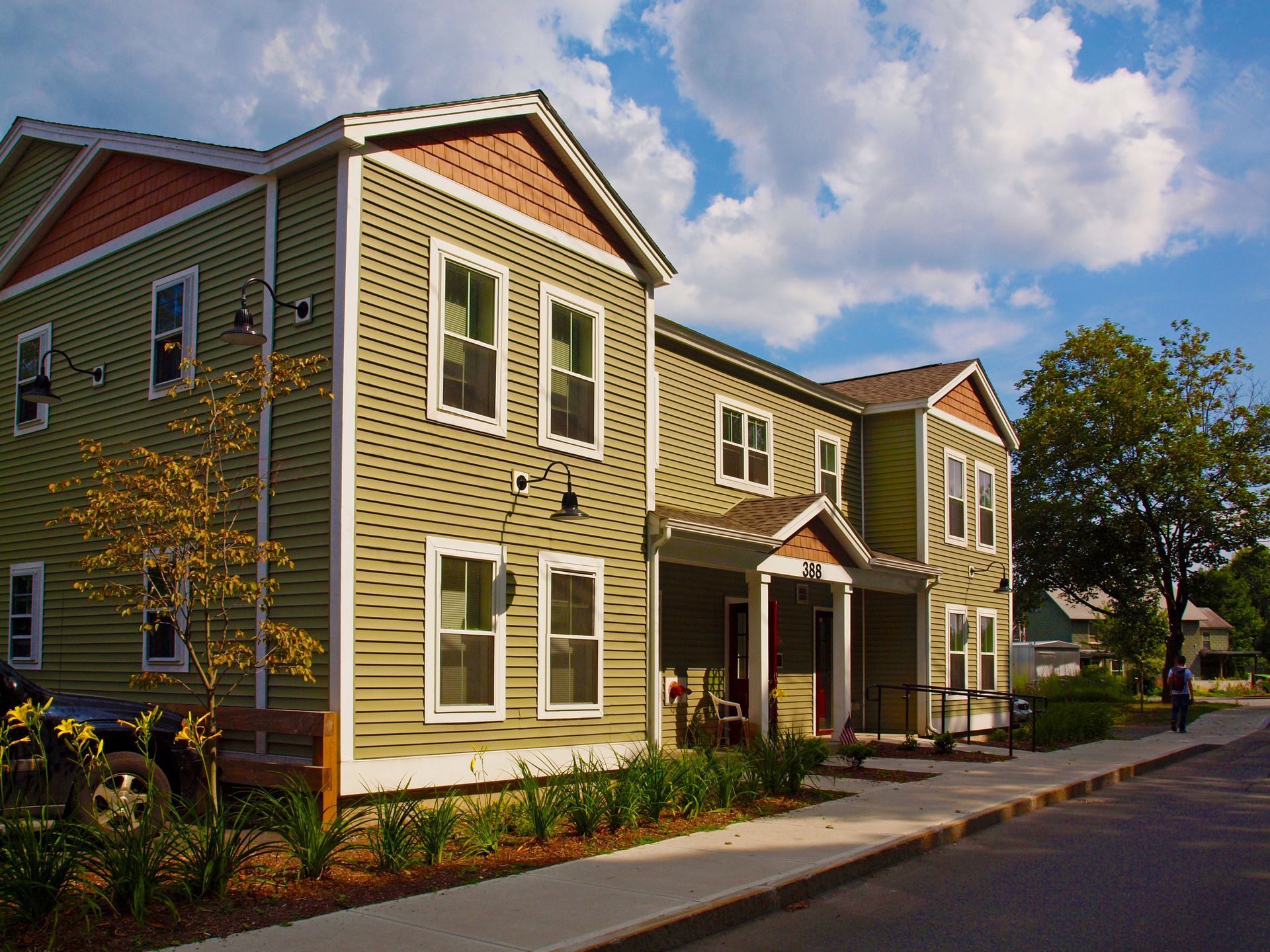 A house with a lot of windows and a porch