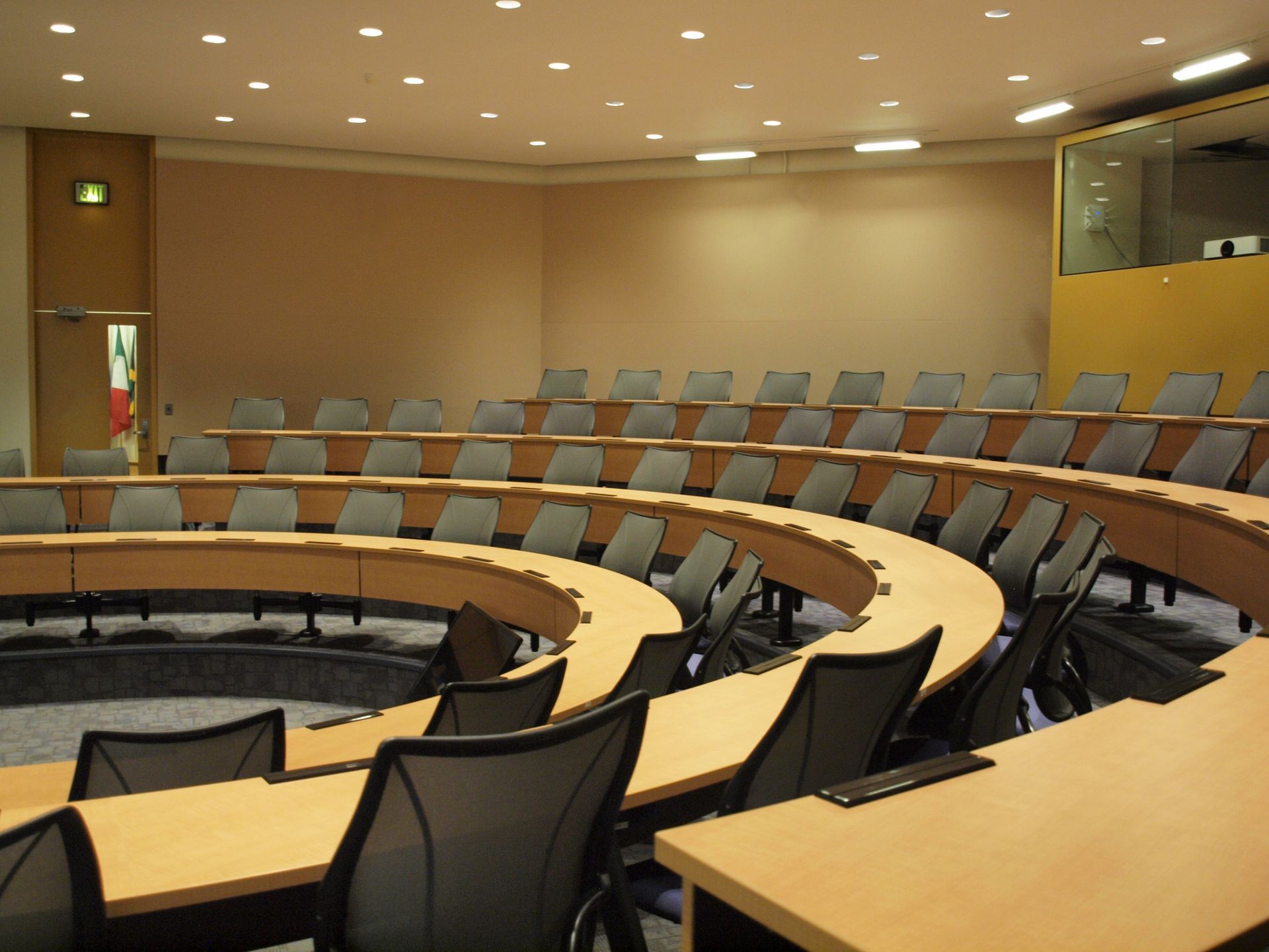 A large empty conference room with tables and chairs