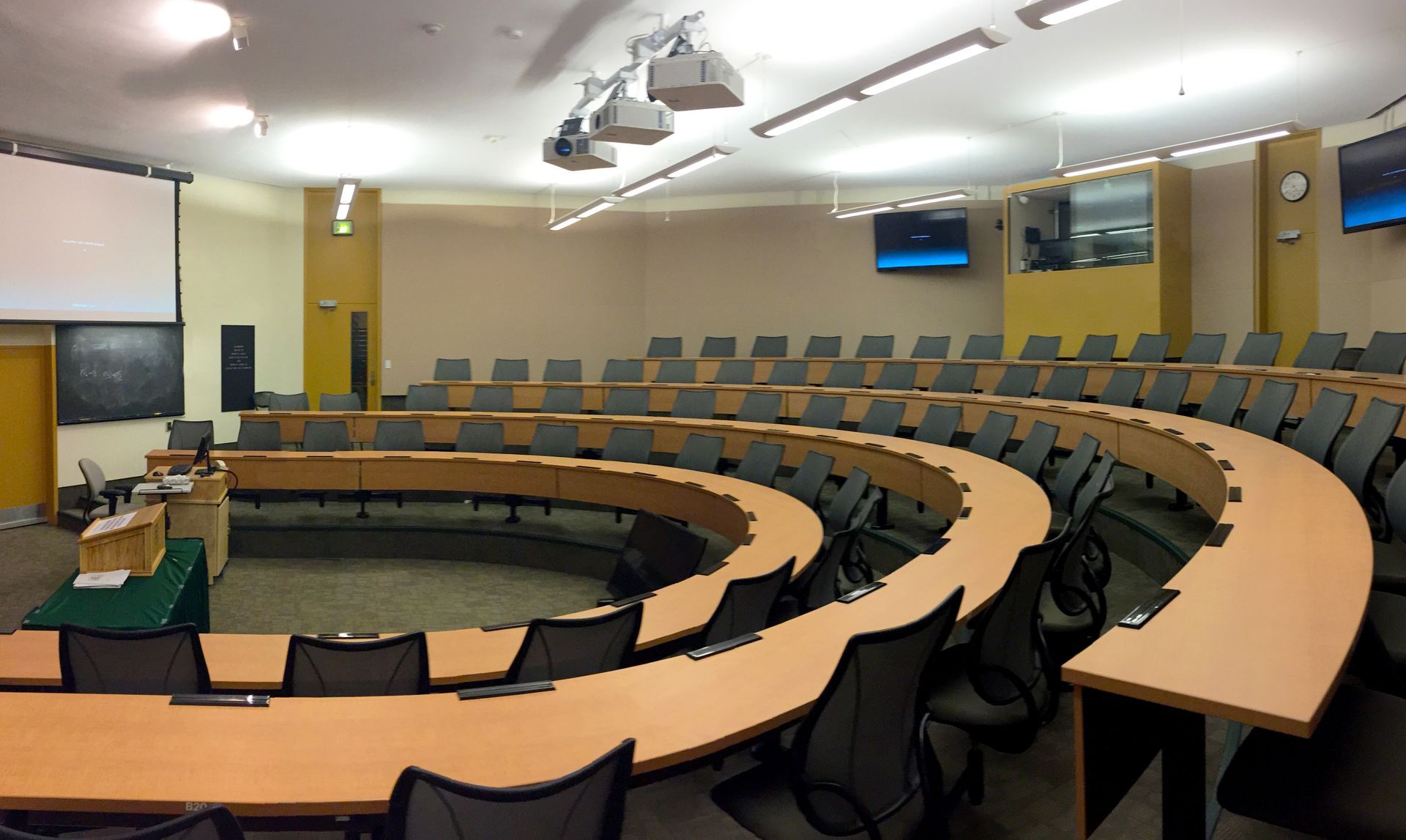 A large empty classroom with tables and chairs