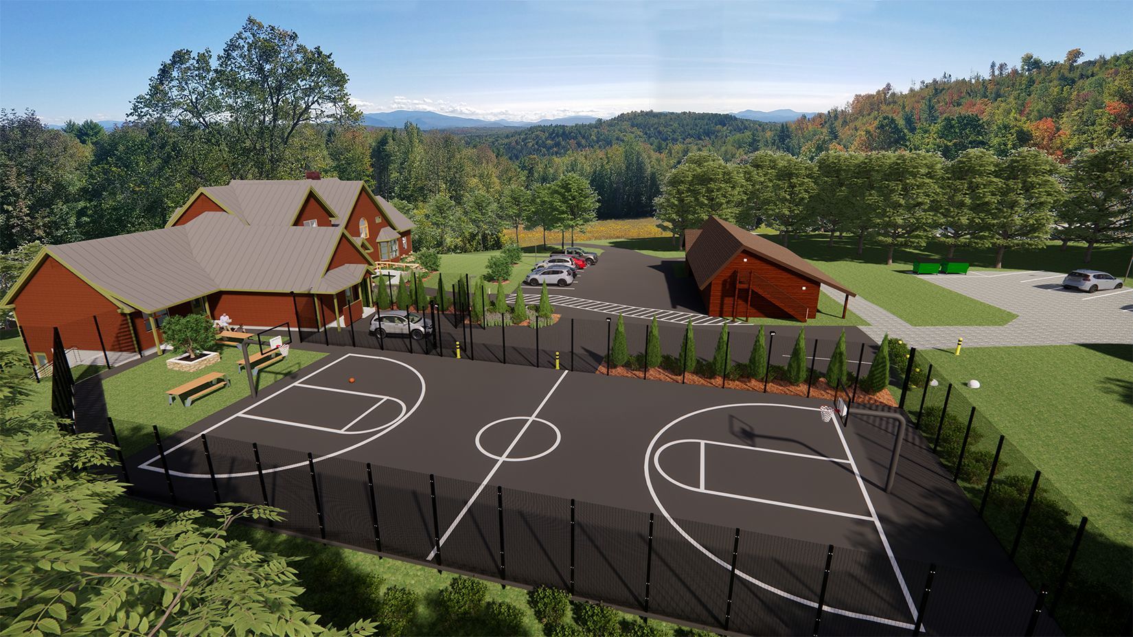 An aerial view of a basketball court with a house in the background.