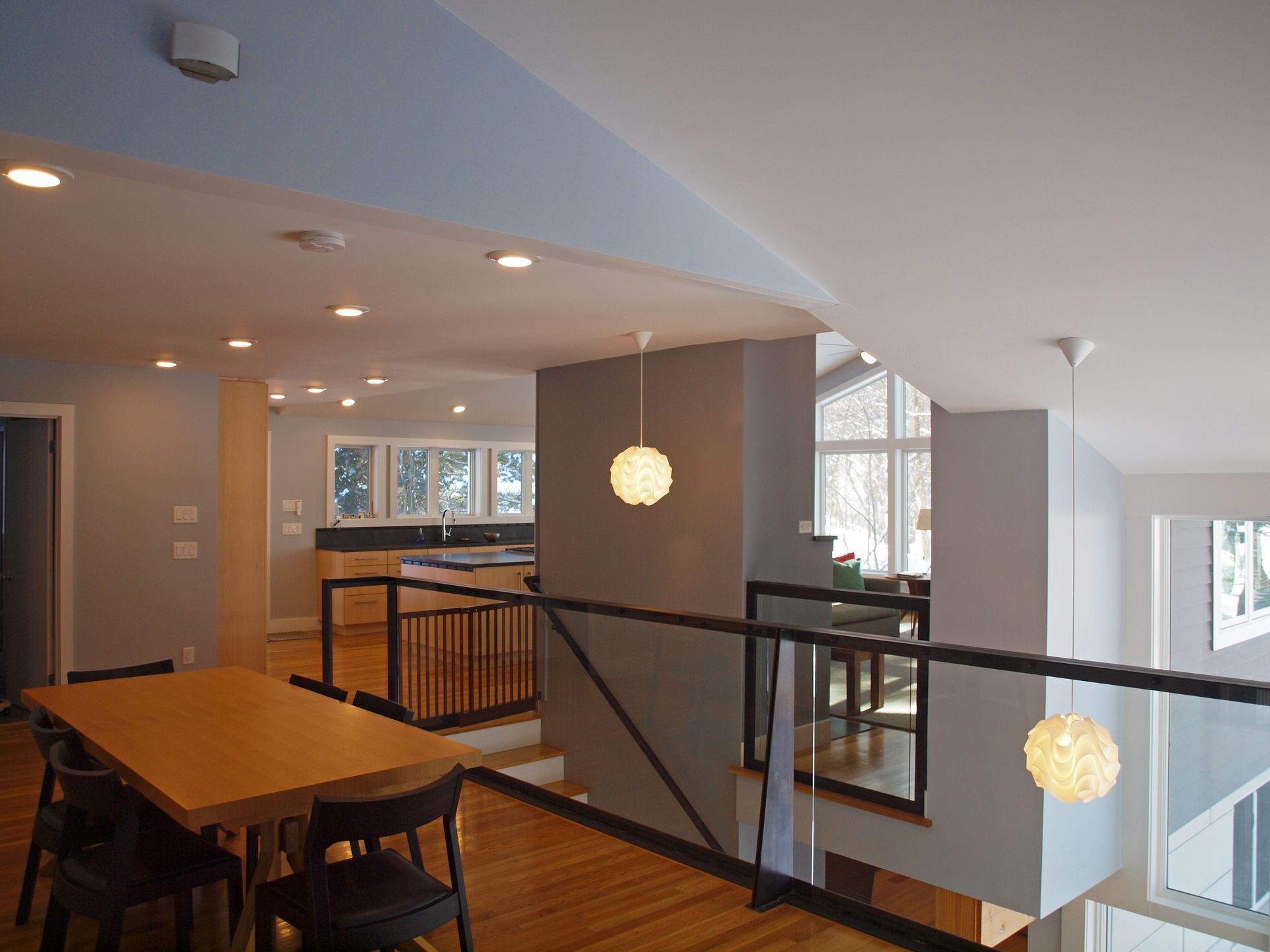 There is a table and chairs in the middle of the room.