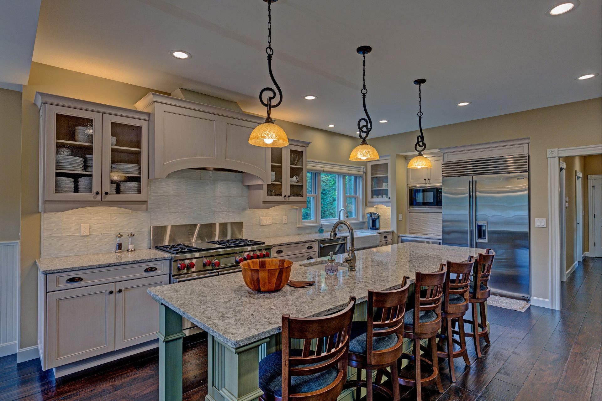 There is a large island in the middle of the kitchen.