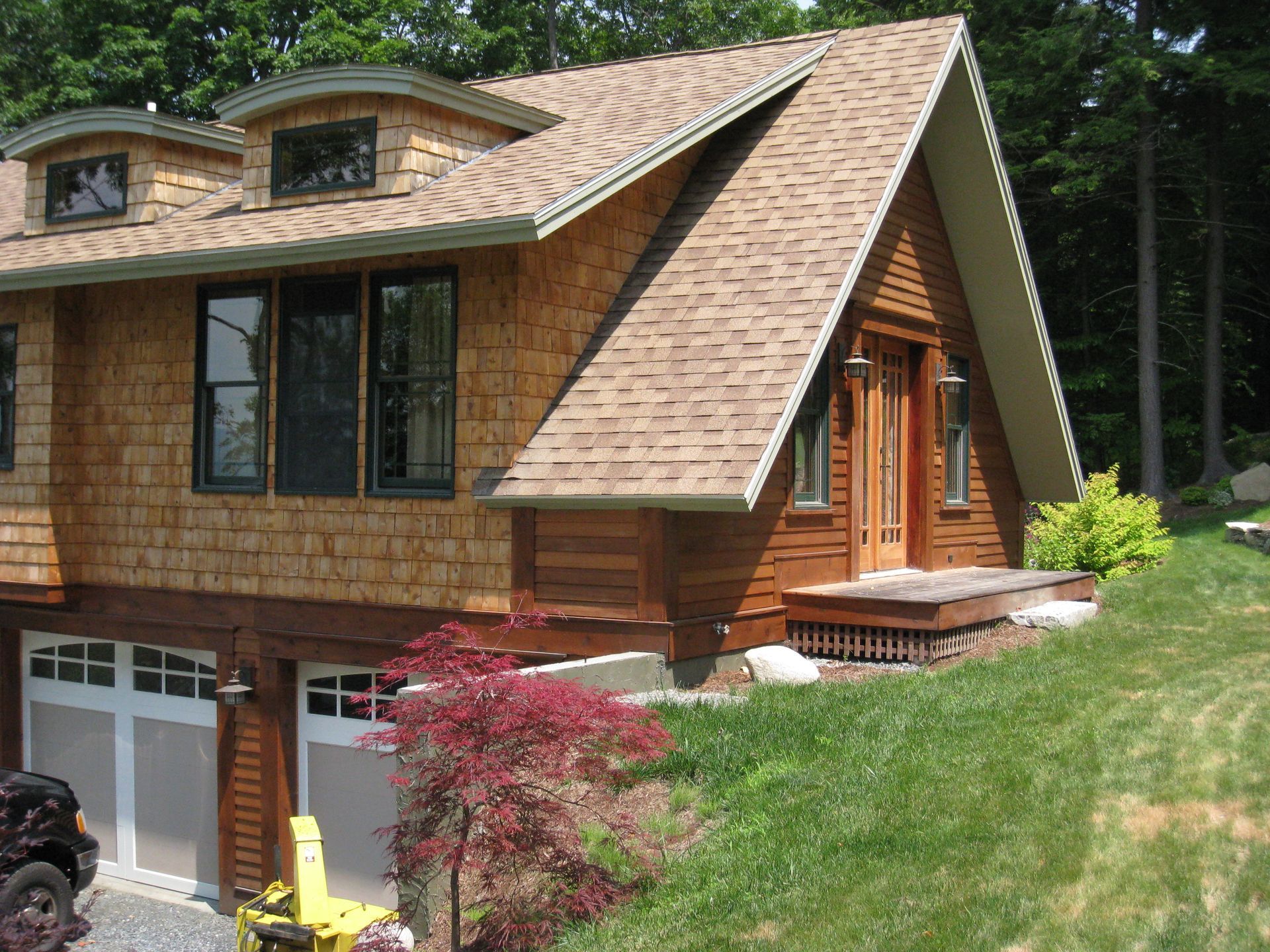 A house with a roof that has shingles on it