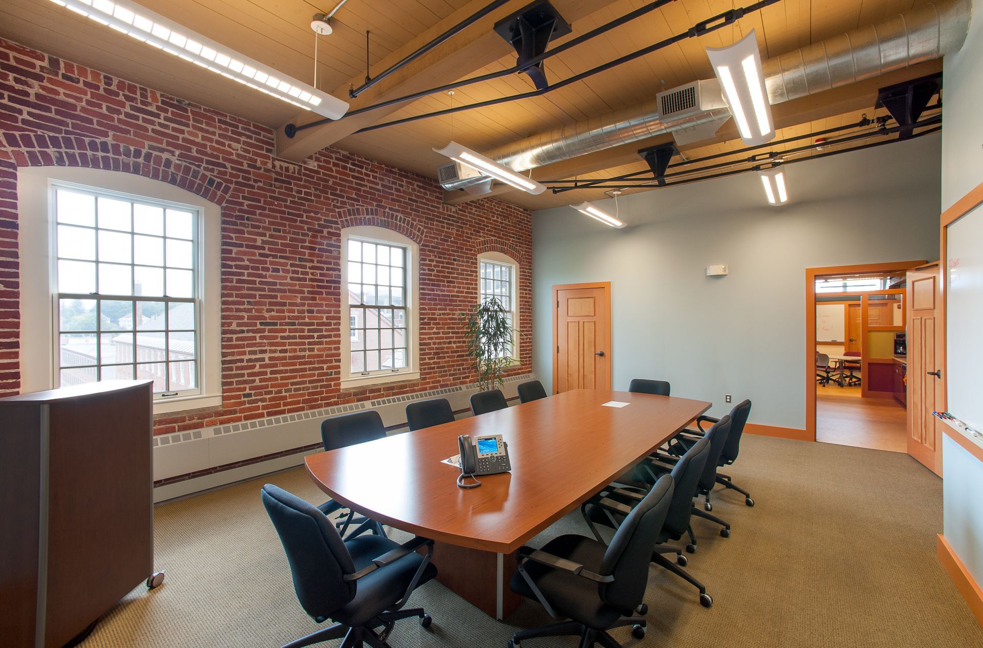A conference room with a long table and chairs