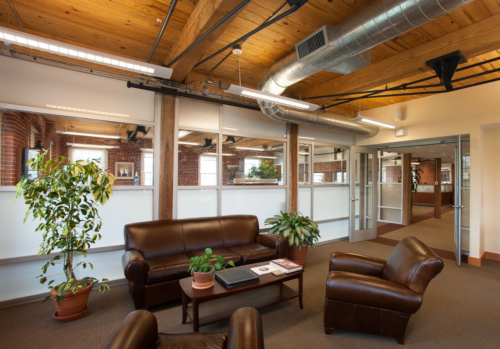 A living room with a couch and two chairs