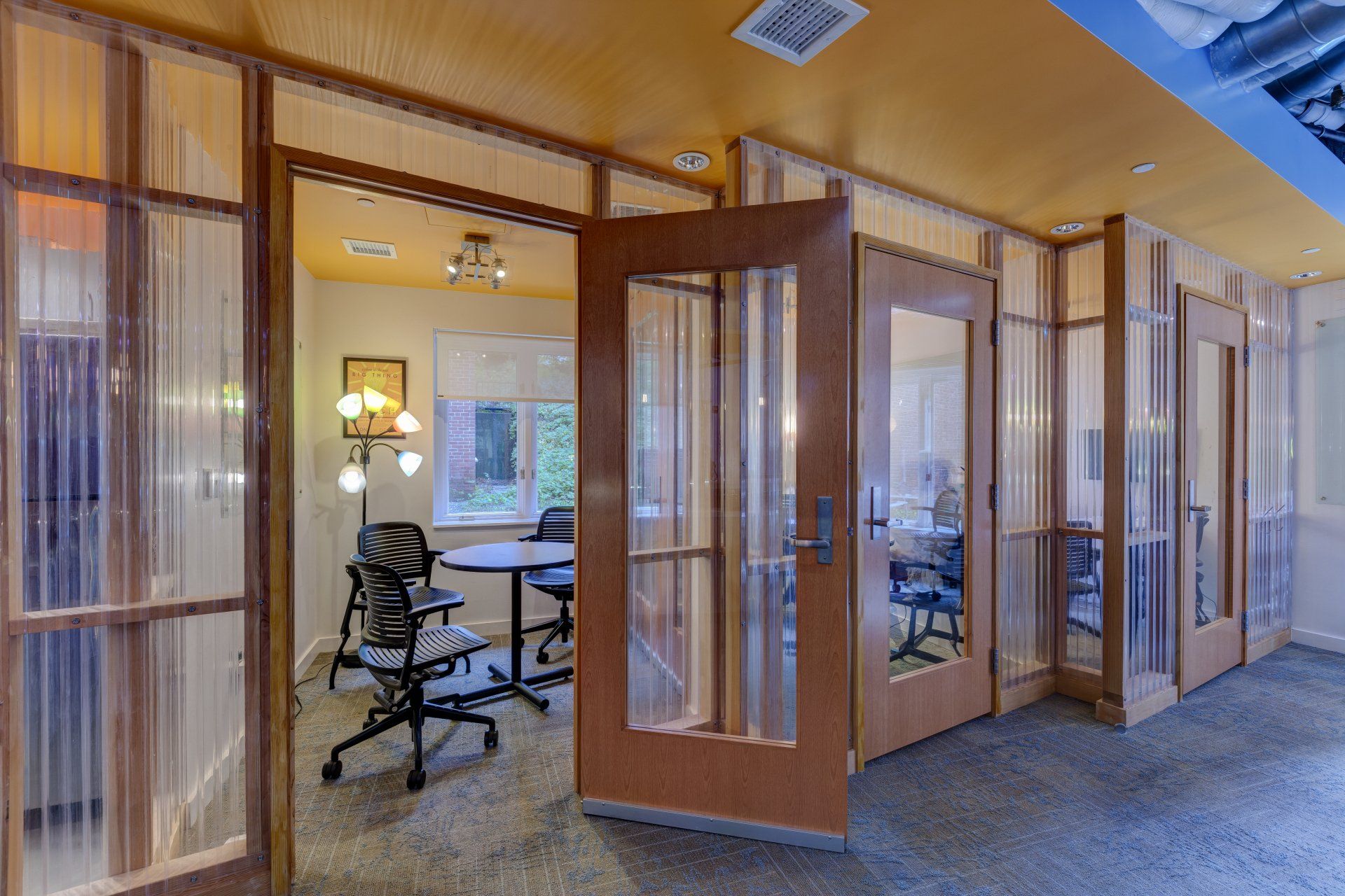 A room with a table and chairs in it.