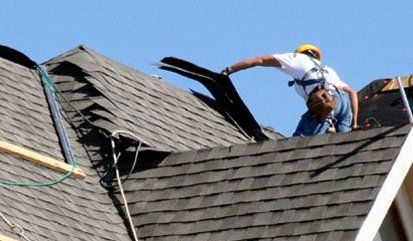 tearing off old shingles